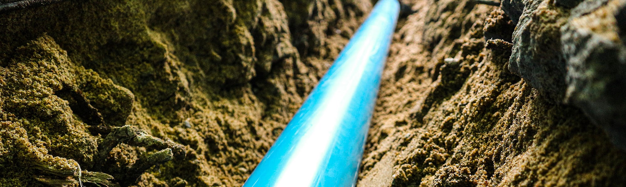 Buried blue pipe